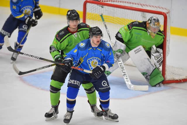 NOT THIS TIME: Leeds Chiefs' Joe Coulter and Hull Pirates' Thomas Stubley battle it out in their NIHL National clash at Elland Road last season. Both teams have not played since early March. Picture: Dean Woolley.