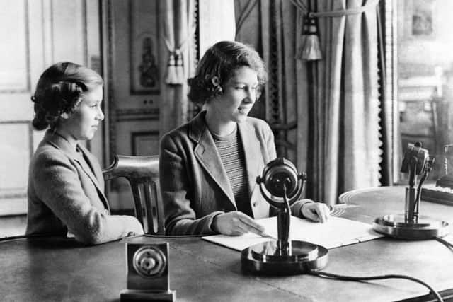 Princess Elizabeth (right) and Princess Margaret make a broadcast to the nation during the Second World War in 1940. Photo: PA.