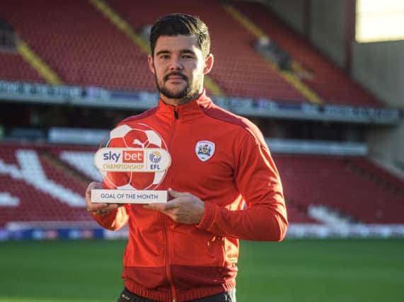 Alex Mowatt, pictured with his Sky Bet goal of the month award for October.