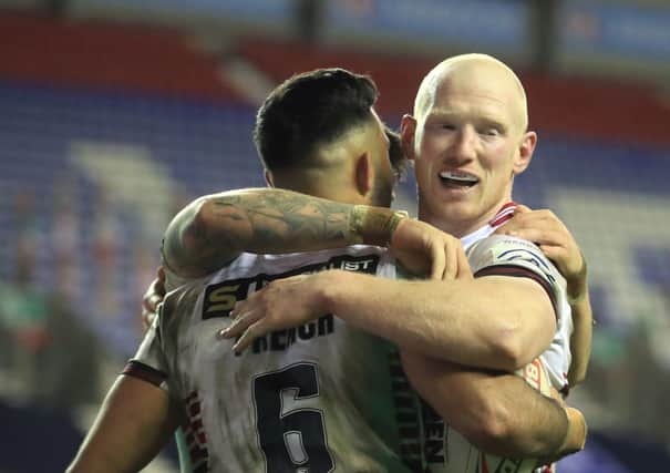 Men of steel: Liam farrell, and his Wigan Warriors team-mate, Bevan French, celebrate a try in the semi-final win over Hull. Both players are in the running for the Man of Steel award on Monday night (Picture: PA)