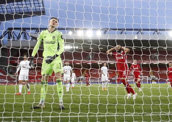 Leeds United's Illan Meslier reacts as Liverpool's Mohamed Salah celebrates after scoring his team's fourth goal at Anfield in September. (Photo by Phil Noble - Pool/Getty Images)