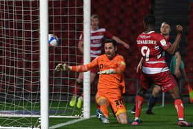 Point made: 

Doncaster's Fejiri Okenabirhie scores a late equaliser. Picture: Andrew Roe