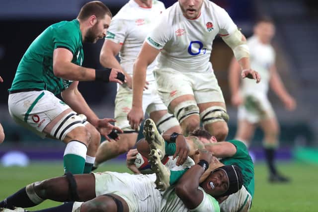 In the thick of it: England's Maro Itoje makes a tackle.