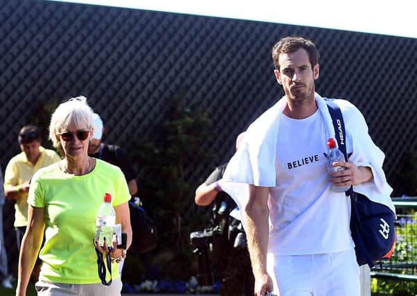 Andy Murray and his mum Judy Murray at the practice courts at the 2019 Wimbledon Championships. Picture: Victoria Jones/PA.