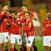 ON THE UP: Cauley Woodrow celebrates scoring Barnsley's second goal against Nottingham Forest at Oakwell on Saturday. Picture: Bruce Rollinson