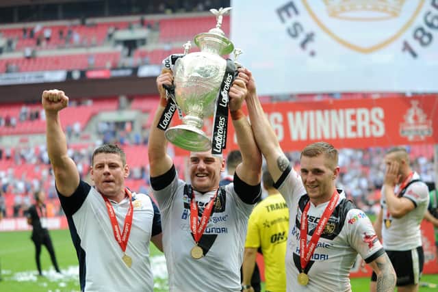 Finally done it: Gareth Ellis holds aloft the Challenge Cup with coach Lee Radfrod and Marc Sneyd, right, aftert the Black and Whites had ended a long wait to lift the trophy at Wembley in 2016. 
Picture: Jonathan Gawthorpe