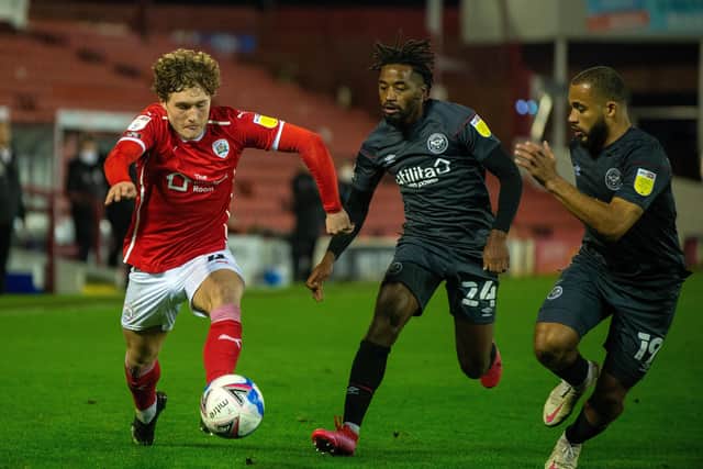 Callum Styles is closed down by Tariqe Fosu and Brayn Mbeumo.   Picture: Bruce Rollinson