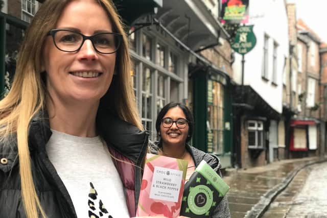 Melanie Fox and Nimishi Ilango, from domestic abuse charity IDAS, hide chocolate bars around York in a bid to spread awareness of help available for victims