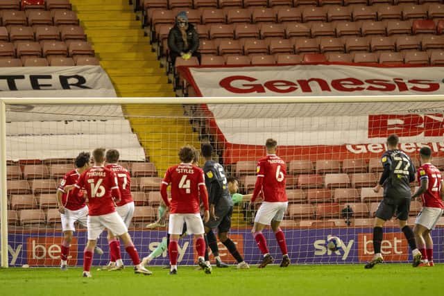 Ivan Toney's shot finds the back of the net to put Brentford in the lead at Oakwell.  Picture: Bruce Rollinson