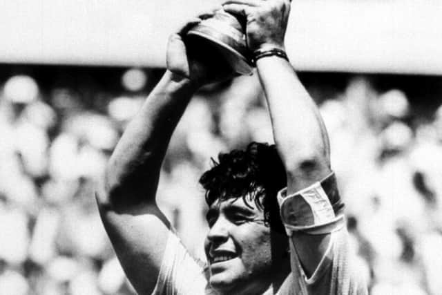 Diego Maradona holds up the World Cup after Argentina beat West Germany in the World Cup Final in Mexico. Former Argentina player and manager Diego Maradona has died aged 60, the Argentinian Football Association has announced. (Picture: PA)