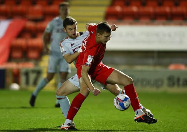 EDGED OUT: Bradford City's Elliot Watt battles with Leyton Orient's Hector Kyprianou at The Breyer Group Stadium on Tuesday night. Picture: Jacques Feeney/Getty Images.