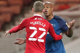 Middlesbrough's George Saville gets some close attention from Derby's Andre Wisdom. Picture: PA.