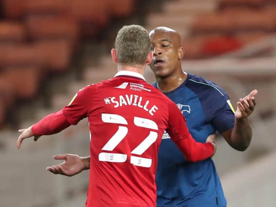 Middlesbrough's George Saville gets some close attention from Derby's Andre Wisdom. Picture: PA.