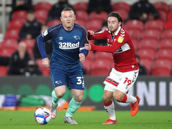 Middlesbrough's Patrick Roberts challenges Derby captain Wayne Rooney. Picture: PA.