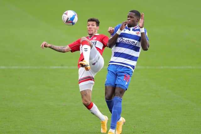 Middlesbrough's Marvin Johnson (left) and Reading's Lucas Joao battle for the ball during. Picture: Richard Sellers/PA