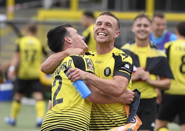 Harrogate Town's Jack Muldoon and Ryan Fallowfield celebrate last season's play-off success. (Photo by George Wood/Getty Images)