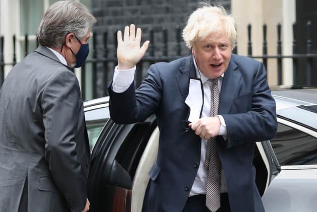 Boris Johnson arrives back in Downing Street following his first public appearance after two weeks in self-isolation.