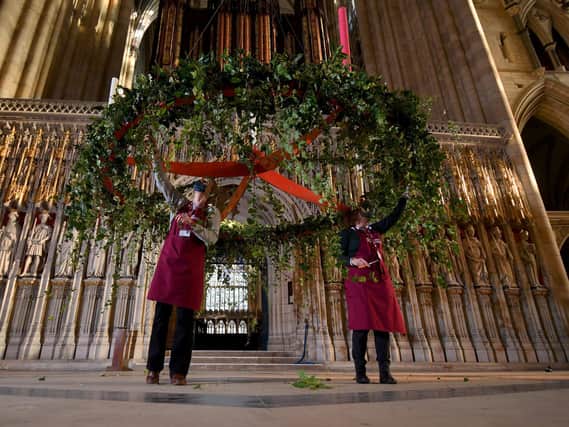 Head Flower Arranger Mandy Barker (right) and Flower Arranger Liz Freeman picture at work on the Advent Wreath back in its traditional position below the Central Tower at York Minster. Picture by Simon Hulme.