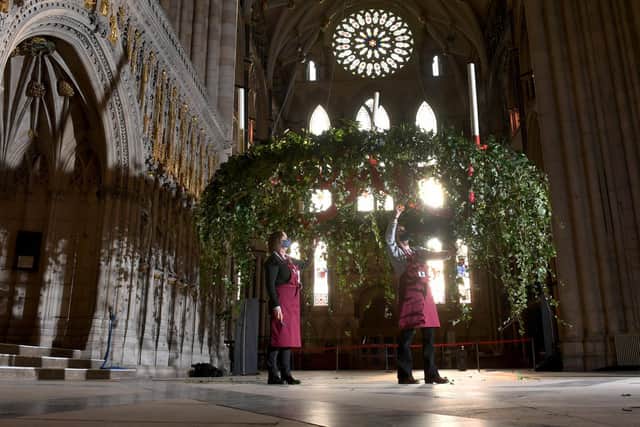 Head Flower Arranger Mandy Barker (left) and Flower Arranger Liz Freeman at work on the Advent Wreath back in its traditional position below the Central Tower at York Minster. Picture by Simon Hulme.