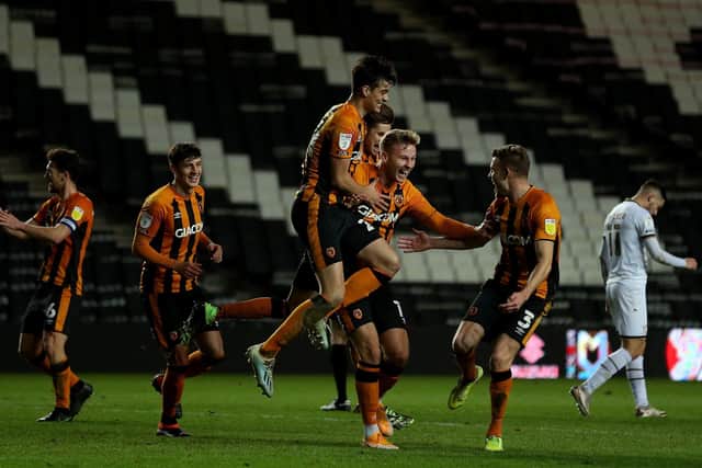 Hull City's James Scott celebrates scoring against MK Dons in front of the empty KCom Stadium (Picture: PA)