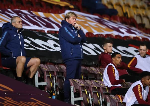 Bradford manager Stuart McCall in the stands at Valley Parade last month Picture: Martin Rickett/PA