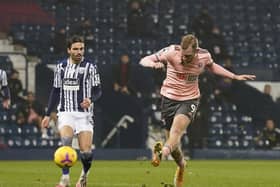 BLANK: Sheffield United centre-forward Oli McBurnie shoots at goal