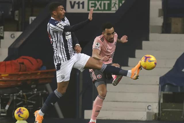 Sheffield United's Kean Bryan plays a pass under pressure from West Brom's Karlan Grant at The Hawthorns. Picture: Andrew Yates/Sportimage