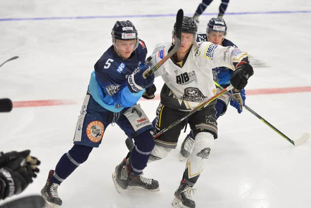 Sheffield Steeldogs' Brady Doxey tangles with a Lightning opponent. Picture courtesy of Dean Woolley.