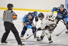 JUST SEVENTEEN: Sheffield Steeldogs' Jason Hewitt faces offagainst Milton Keynes' Russ Cowley in the final 'Streaming Series' game at Ice Sheffield on Sunday night. Picture courtesy of Dean Woolley.