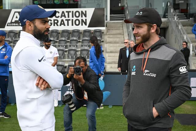 New Zealand captain Kane Williamson (R) talks to India captain Virat Kohli after New Zealand won the Test series on day three of the second Test cricket match between New Zealand and India , part of the World Test Championship (Picture: PETER PARKS/AFP via Getty Images)