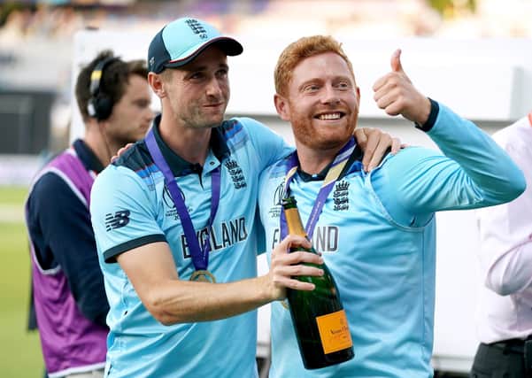 MAGIC MOMENT: Chris Woakes (left) and Yorkshire's Jonny Bairstow celebrate winning the ICC World Cup Final against New Zealand at Lord's last summer. Picture: John Walton/PA