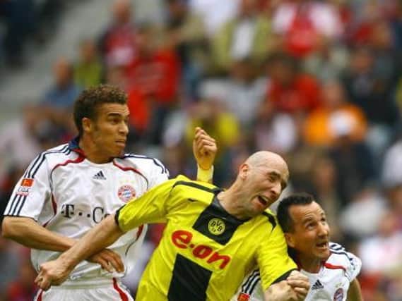 AERIAL DUELS: Valerien Ismael (left) competes for the ball with Jan Koller in their days with Bayern Munich and Borussia Dortmund, but he was left concussed by a clash of heads with the Czech in a friendly between Lens and Anderlecht