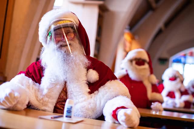 Santas at The Ministry of Fun's Summer School at Southwark Cathedral, London which aims to create COVID-safe Christmas grottos by teaching Father Christmases how to appear safely in person whilst maintaining the Christmas magic.