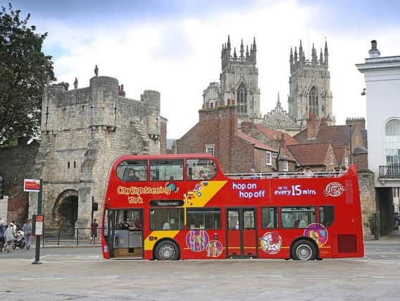 York City Sightseeing’s bright red open top tour buses return after lockdown from this Thursday