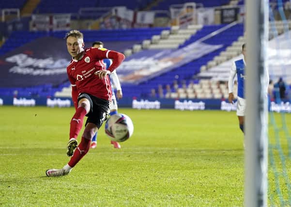 Barnsley's Cauley Woodrow scores his side's first goal of the game from the penalty spot. Picture: PA