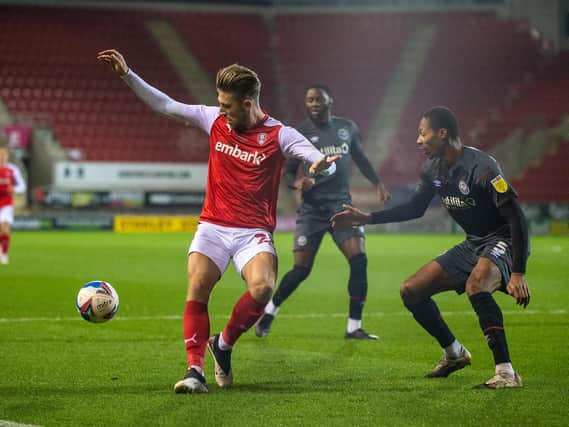 Rotherham United defender Angus MacDonald shields the ball in front of Brentford's Ethan Pinnock. Picture: Bruce Rollinson.