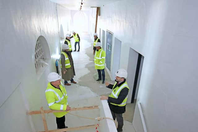Hambleton District Council Chief Executive Justin Ives, front left, chats with Wykeland Group Managing Director Dominic Gibbons as fellow representatives of the Treadmills joint venture partners tour the former Northallerton Prison female wing.
