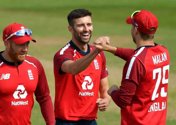 England's Mark Wood (centre) celebrates with Yorkshire pair Jonny Bairstow, left, and  Dawid Malan. Picture: Dan Mullan/NMC Pool/PA Wire.