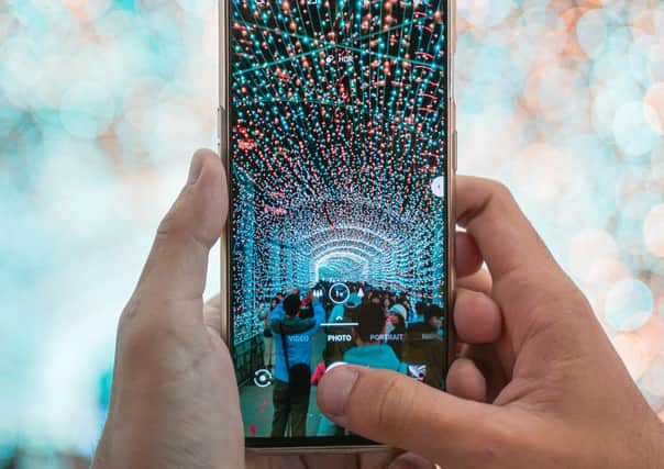 Your new Christmas phone could be the gateway to a new world. Picture: Unsplash/Lisanto