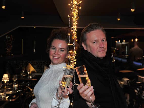Toast: Louise Robertson-Rennard and Jay Rennard raise a glass to their new bar and pizzeria, Hidden, which is set to open its doors on December 4.