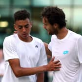 Joao Sousa (right) shakes hands with Paul Jubb after their match on day two of the Wimbledon last year. Picture: Steven Paston/PA