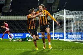 Winner: Hull City substitute Tom Eaves celebrates his goal  with Callum Elder after Doncaster Rovers goalkeeper Joe Lumley fumbled the ball. (Picture: Tony Johnson)