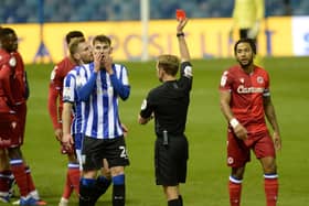 Red card for Owls' Liam Shaw for his tackle on Reading's Omar Richards.   Pictures: Steve Ellis