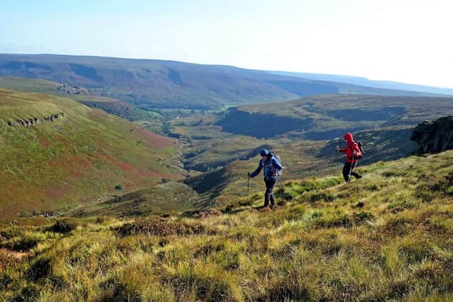 Pictured hikers in the Peak District above Crowden Great Brook on the Pennine Way in September this year. Photo credit: Tony Johnson/JPIMedia