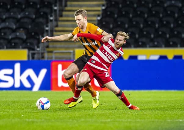 Hoping to stay: Hull City's Callum Elder tussles with  Rovers loanee  Josh Sims. Picture: Tony Johnson