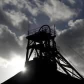 The sun shines behind the headframe of a shaft mine at the National Coal Mining Museum based on the site of the former Caphouse Colliery in Overton, near Wakefield. Photo: OLI SCARFF/AFP via Getty Images)
