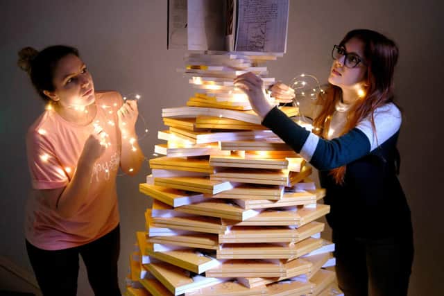 Louise Precious (left) and Megan McKenna from Fairfax House in York decorating the book tree. Picture: Gary Longbottom.