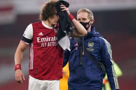 David Luiz is led off the field with a head injury (Picture: PA)