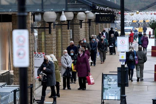 Christmas shoppers in Halifax..Shoppers outside Marks and Spencers...3rd December 2020. Pic: Simon Hulme