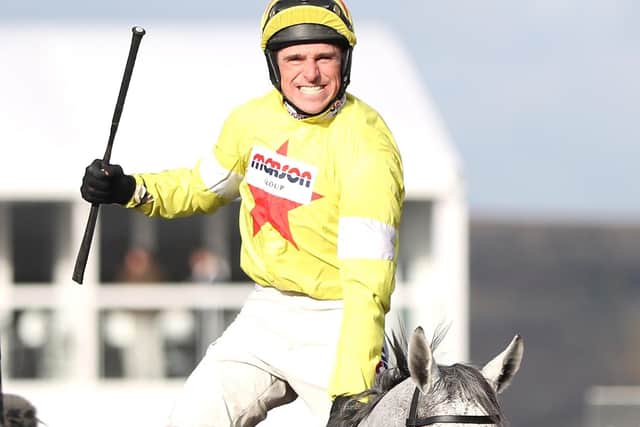 Harry Skelton and Politologue return to the Queen mother Champion Chase winners' enclosure.